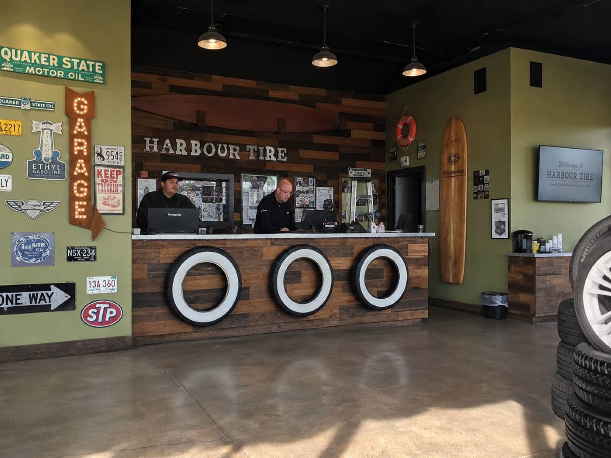 front desk of a tire shop with two men working at Harbour Tire a Huntington Beach automotive shop.