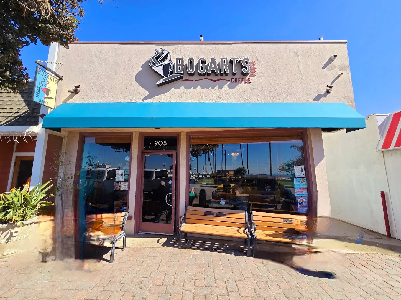 Front facade of Bogarts Coffee Shop with the name at the top of the building,